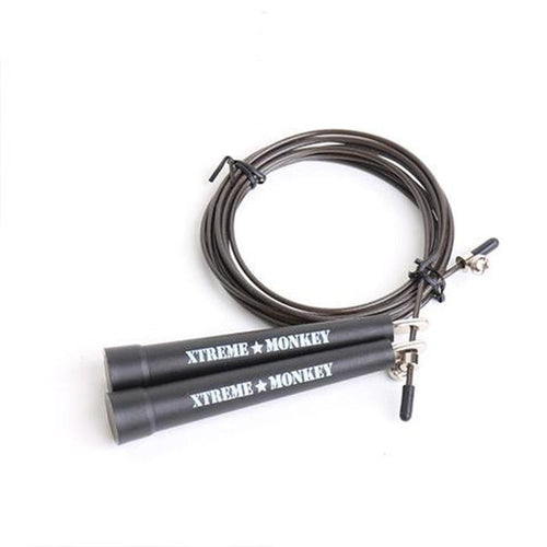 XM Fitness speed rope coiled with black handles