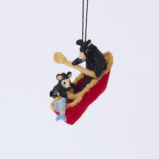 Handmade felt Bears in a Canoe ornament from Craftspring rotating to show front, side, and back views—featuring a mama bear paddling a canoe with a cub climbing over the side, ethically crafted by artisans using sustainable wool.