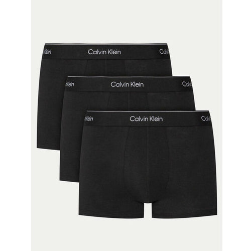 Image 1 : Lot de 3 boxers trunks Calvin Klein Underwear homme coloris noir avec ceinture élastique logo blanc sur fond blanc — Delvale