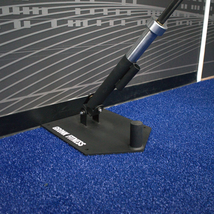 Gronk Landmine Platform with barbell on blue turf