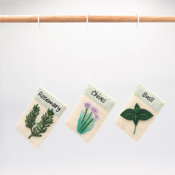 Set of three felt herb ornaments styled like seed packets—eco-friendly and handcrafted