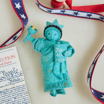 Celebrate American independence with this handcrafted July 4th Lady Liberty Ornament. Inspired by the Statue of Liberty and the founding of the United States, it's perfect for Christmas trees, Fourth of July celebrations, and Americana holiday décor.