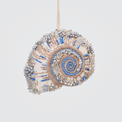 Craftspring’s Moon Snail Shell Ornament rotating to show front, side, and back views — made of satin with intricate beaded and embroidered details, ethically crafted by artisans.