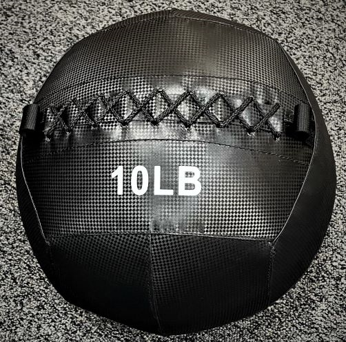 G&G Fitness 10LB black wall ball on textured floor