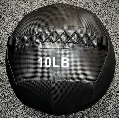 G&G Fitness 10LB black wall ball on textured floor