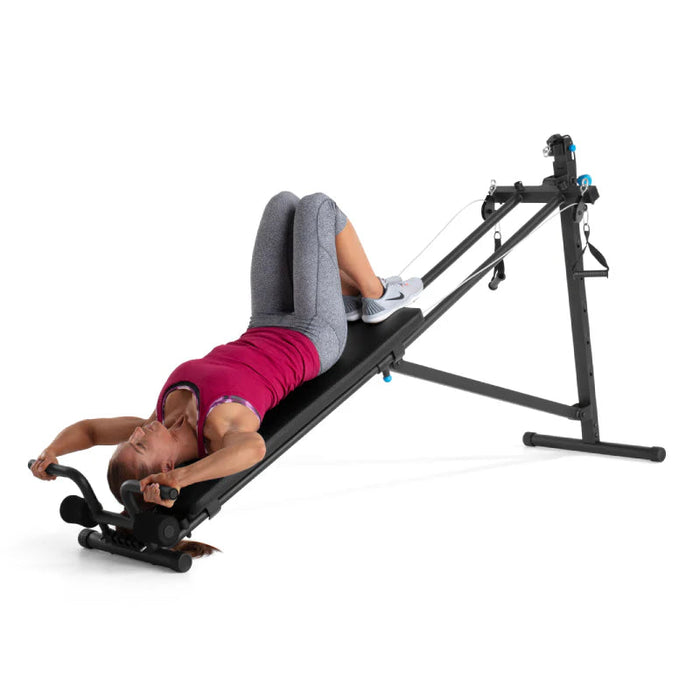 ProForm bench with woman doing incline leg exercise
