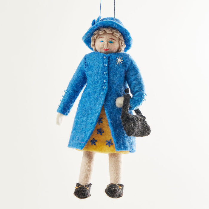 Queen Elizabeth II felt ornament wearing royal blue coat and hat, with black handbag and detailed embroidery. Handmade wool Christmas ornament honoring British royalty. Fair trade and ready to hang.
