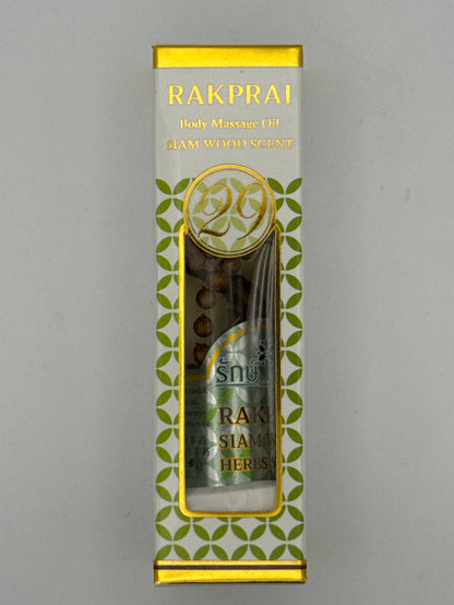 Front photo: Rakprai Body Massage Oil Siam Wood Scent box with gold trim, green pattern, and bottle visible through the front window.
