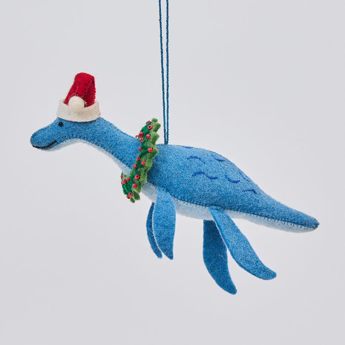 Handmade felt Santa Plesiosaurus ornament from Craftspring, featuring a dinosaur with a Santa hat, festive wreath, and intricate beaded and embroidered details—heirloom-quality holiday decor, ethically crafted by artisans using sustainable wool.