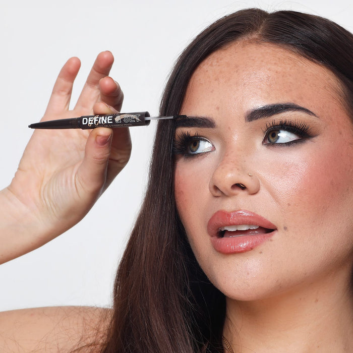 Woman applying tinted brow gel spoolie from Technic Define & Set tool