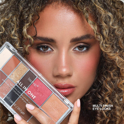 Woman holding Technic All-In-One multi-finish eyeshadow palette