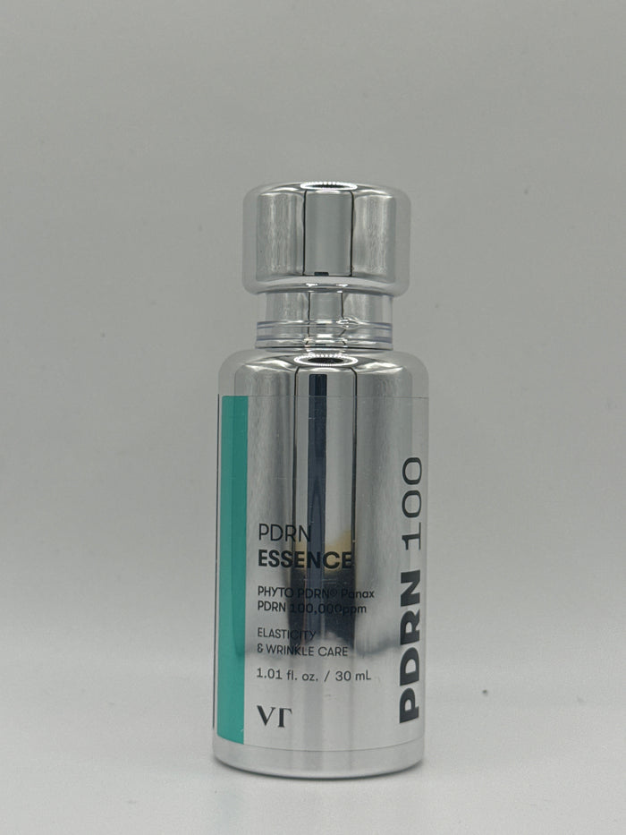 VT PDRN Essence 100 30 ml silver bottle with teal accent and silver cap, front view.