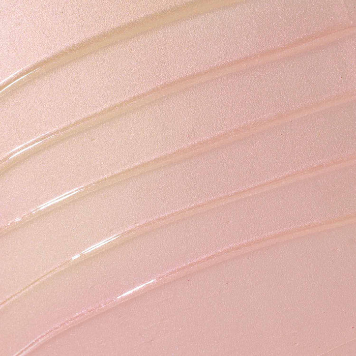 A close-up texture swatch of the Over the Garden Wall body oil: shimmering, light pink to gold tone