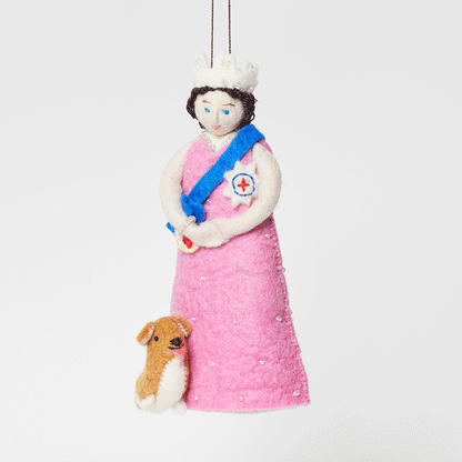 Young Queen Elizabeth II felt ornament in gala attire with a loyal corgi at her side. Handmade wool Christmas ornament honoring British royalty. Fair trade and ready to hang. GIF 360 degree view