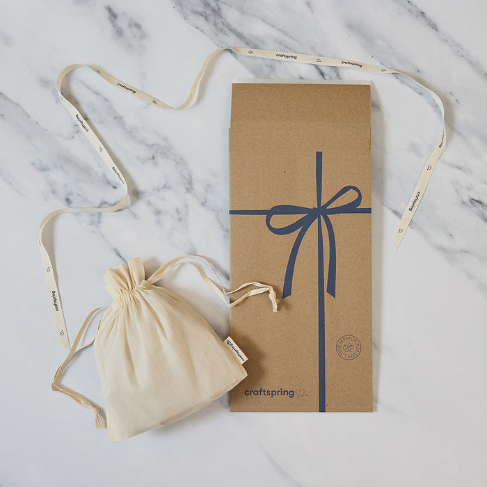 Soft cloth pouch used to package each Craftspring ornament, highlighting sustainable and ready-to-gift design
